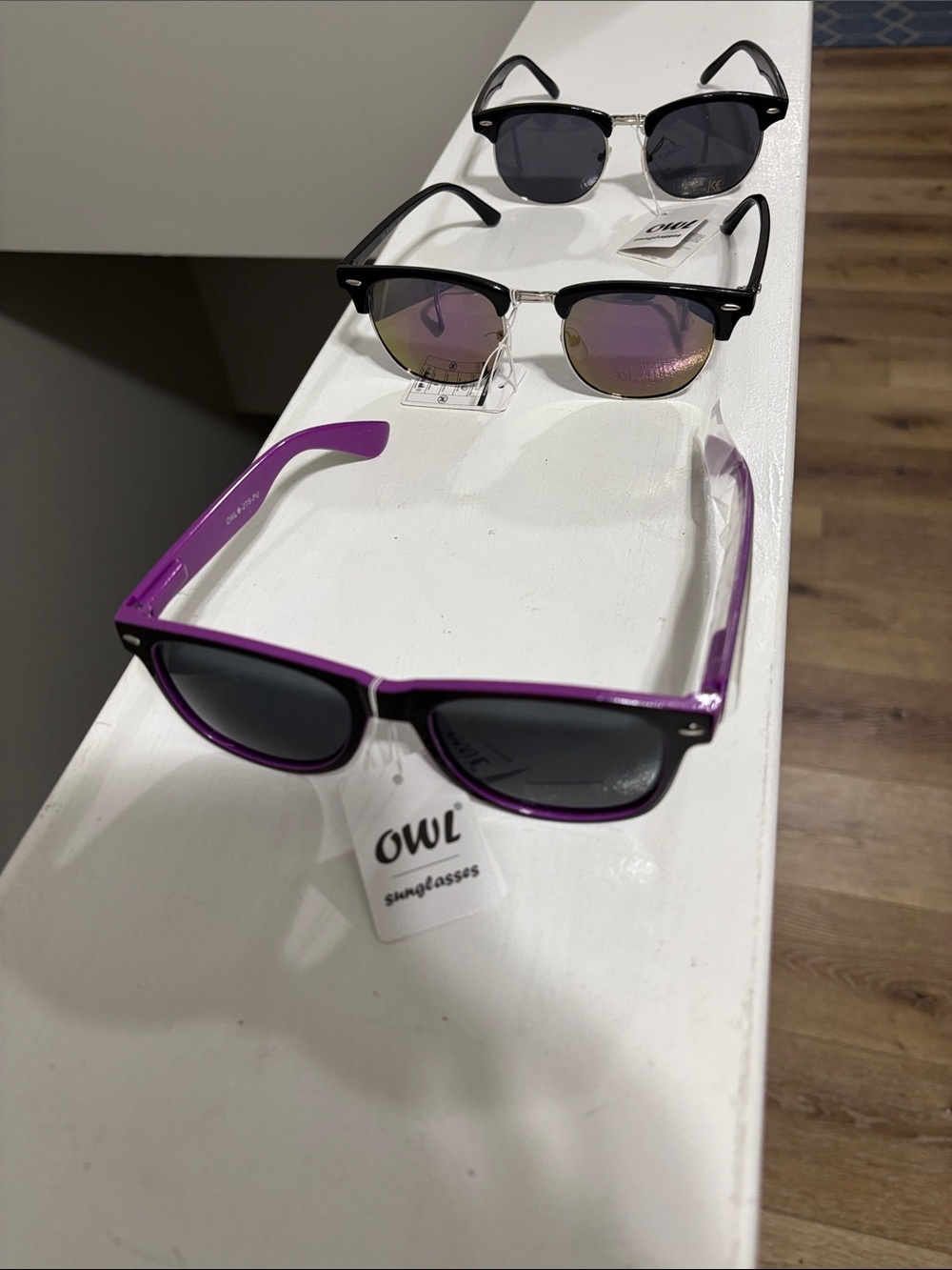 3 pair owl sunglasses with tags.